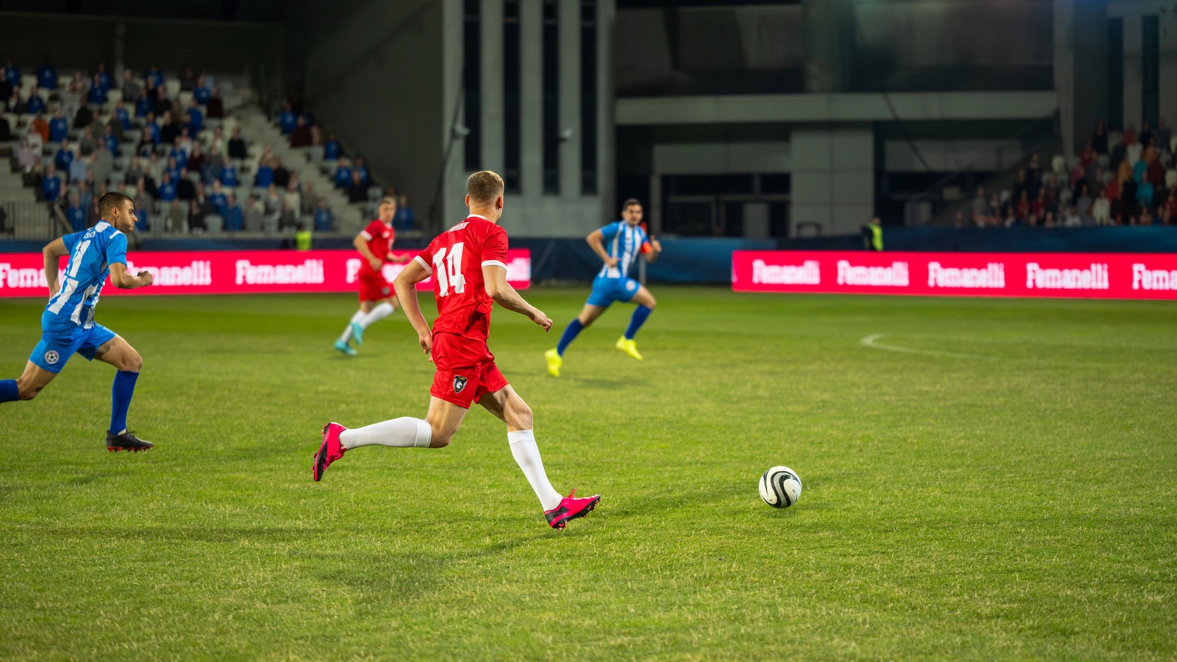 Football players competing for the ball during a match