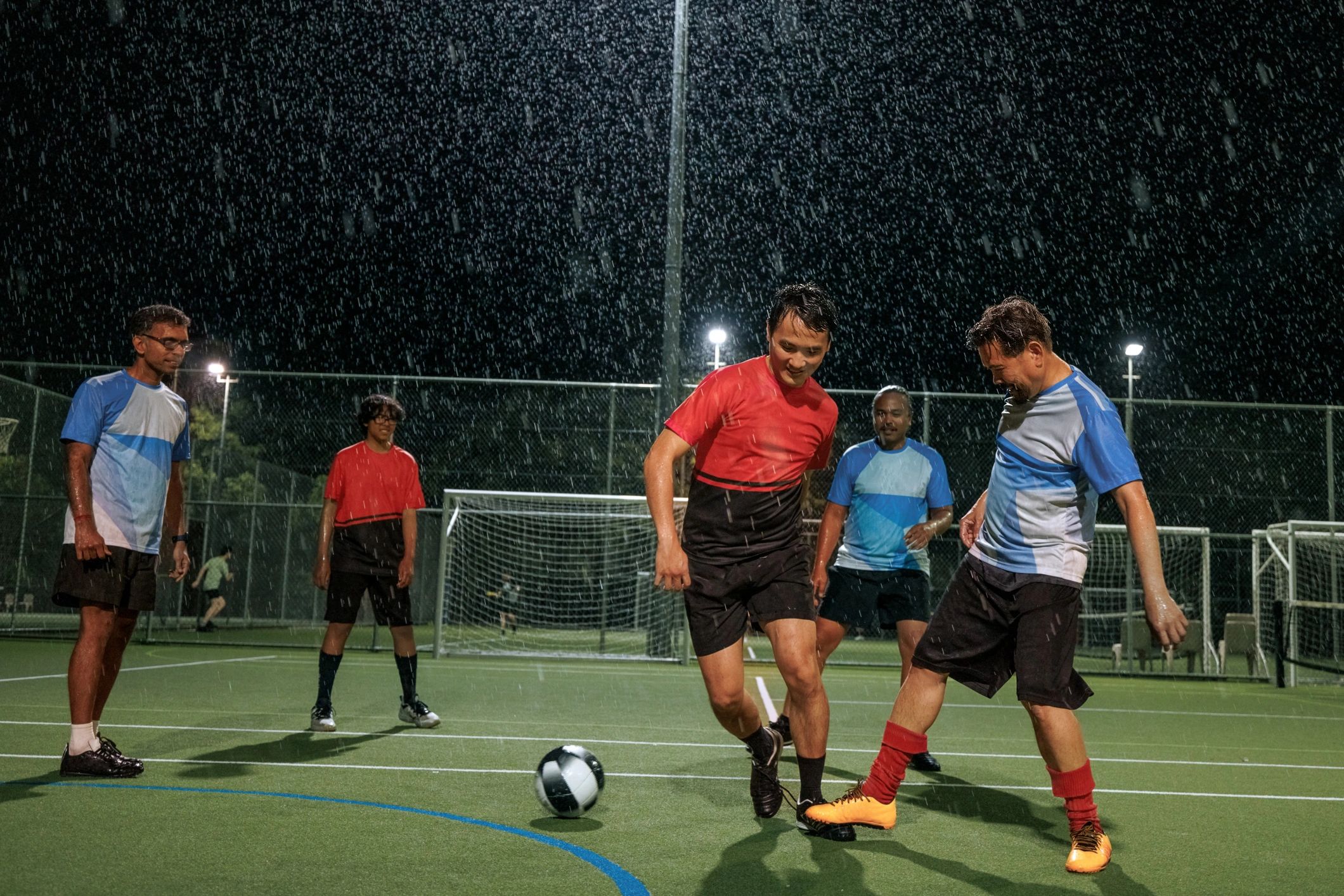 Competitive team sport under stadium lights