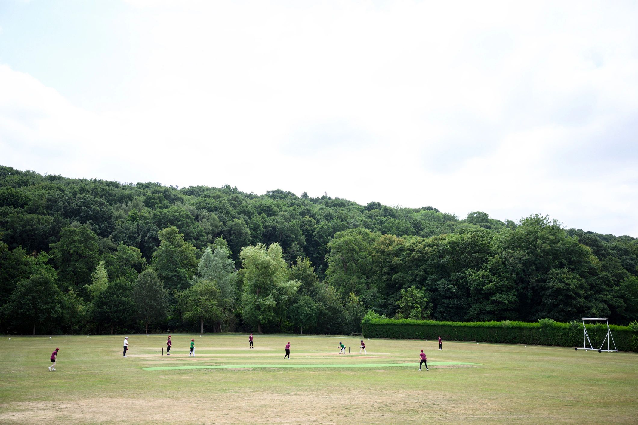 Cricket players competing on a field