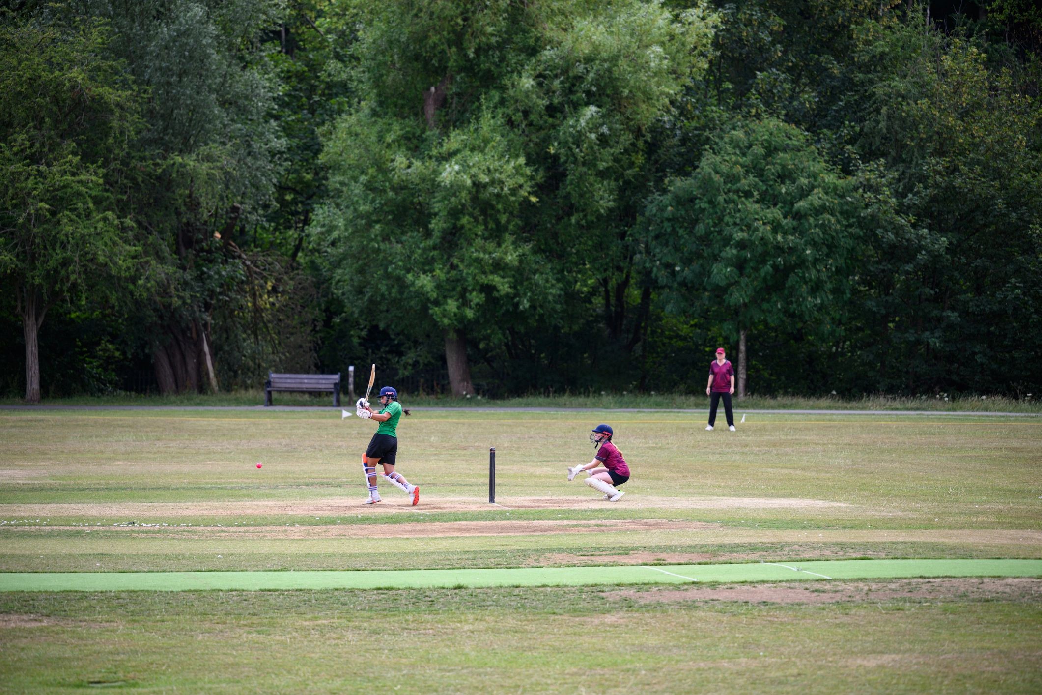Cricket batter playing a shot during a match
